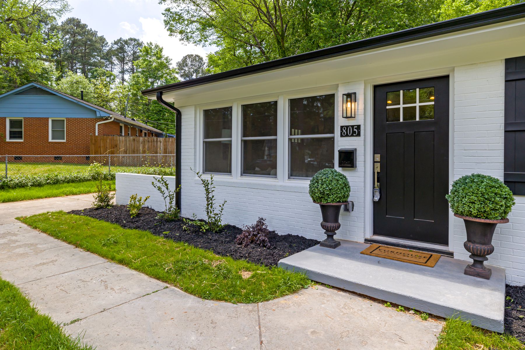 A welcoming residential home with a landscaped front yard